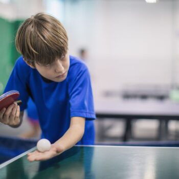 Boy playing table tennis